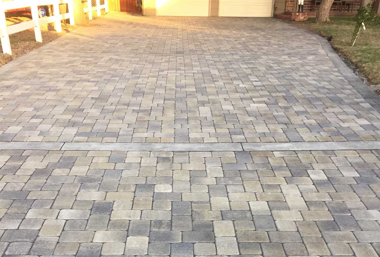 Angelus Antique Cobble paver driveway in Gray Moss Charcoal color